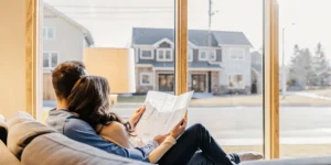 Couple checks FHA loan qualifications.