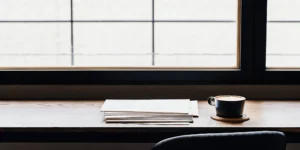 Bank statements organized on a desk to meet loan application requirements.