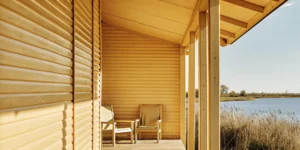 A vacation home with a porch overlooking a lake, financed with a 10 percent down loan.