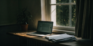 Using a DSCR loan calculator on a laptop to check investment property requirements.