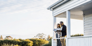 Couple comparing offers from different no closing cost refinance lenders.