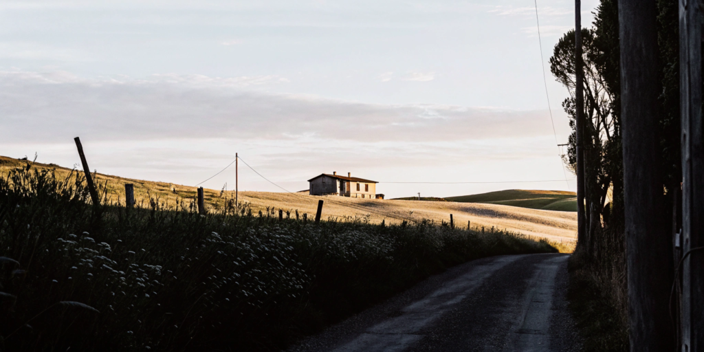 A country house on a rural road in a USDA eligible area.