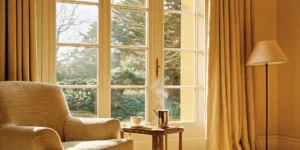 A sunlit living room in a home purchased by calculating a safe mortgage percentage of income.